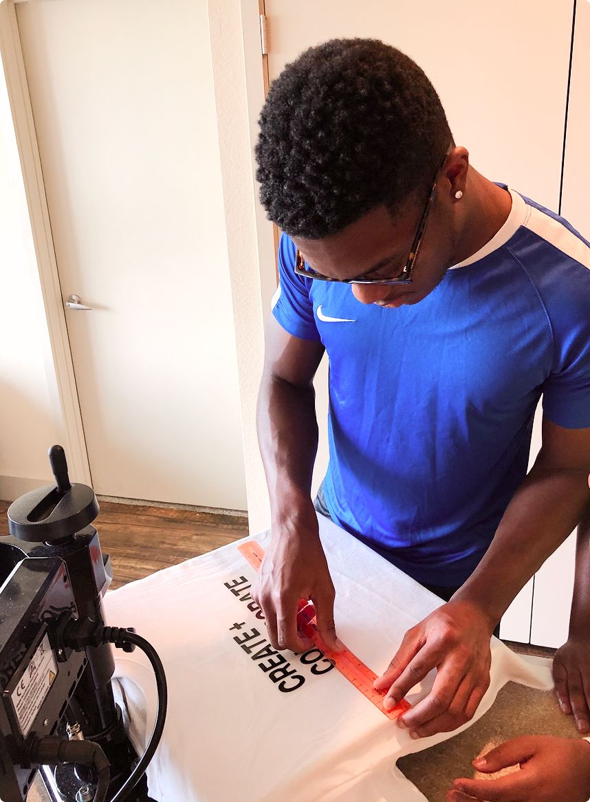 boy decorating a t-shirt